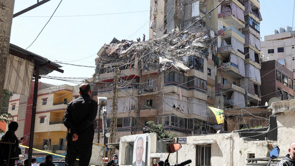 PHOTO: Onlookers gather as rescuers work at the site of an Israeli strike in the southern suburbs of Beirut, Lebanon, on May 7, 2026.