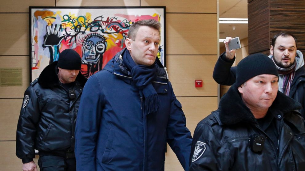 Alexei Navalny, center, escorted by Moscow bailiffs in Moscow, Russia in this Jan. 31, 2017 file photo.