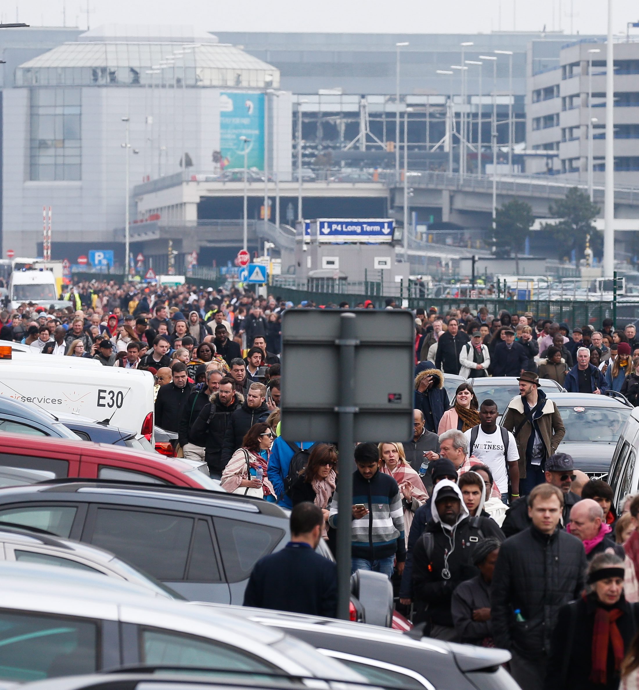 PHOTO: Passengers and airport staff are evacuated from the terminal building after explosions at Brussels Airport in  Brussels,  March 22, 2016. 