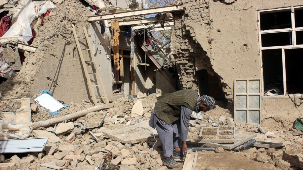 An Afghan man surveys the houses damaged in NATO airstrikes in Kunduz, Afghanistan, Nov. 4, 2016. 