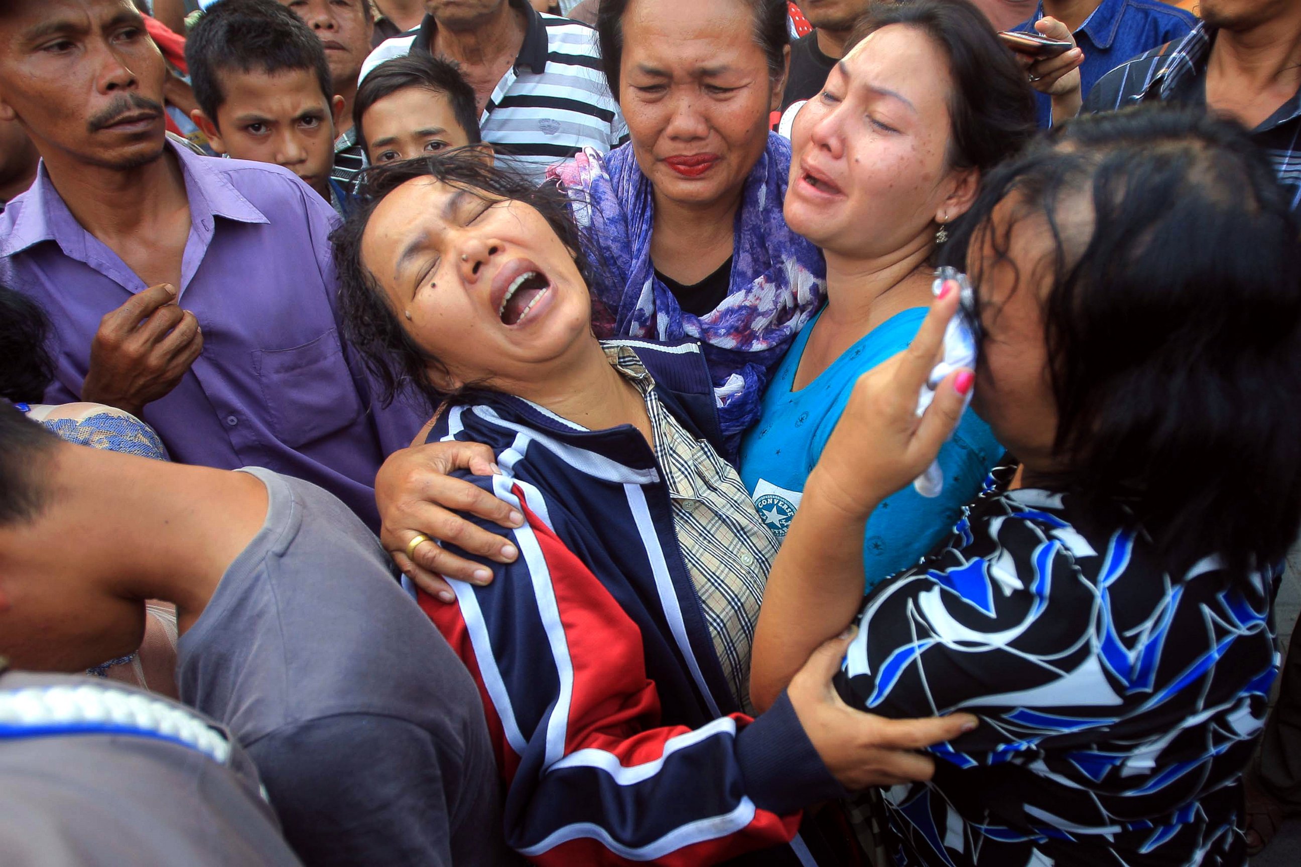 PHOTO: Relatives of one of the victim of the crashed military airplane mourn as they wait for the body of the victims at a military hospital in Medan, North Sumatra, Indonesia, June 30, 2015.