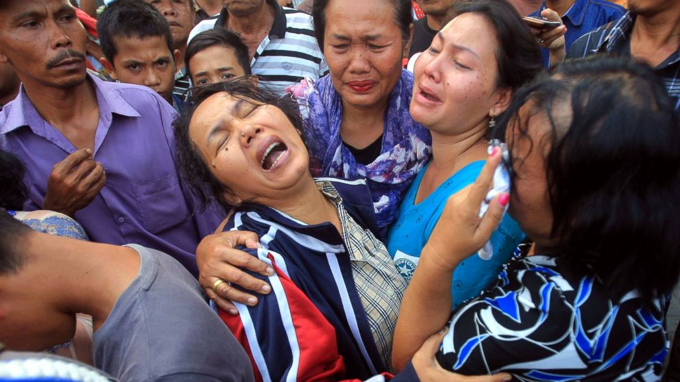 PHOTO: Relatives of one of the victim of the crashed military airplane mourn as they wait for the body of the victims at a military hospital in Medan, North Sumatra, Indonesia, June 30, 2015.
