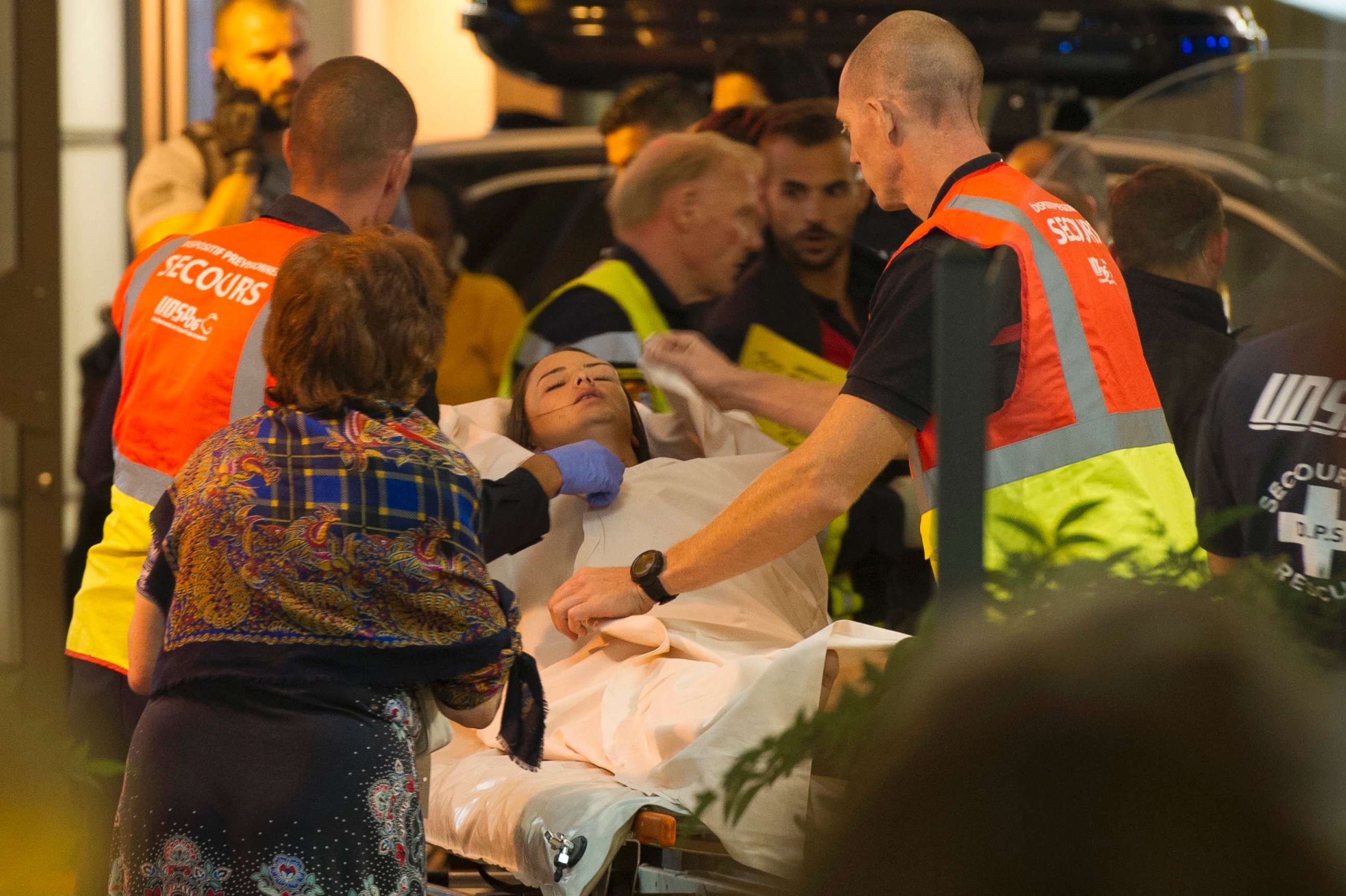 PHOTO: An emergency team assists wounded people as they evacuate from the scene where a truck crashed into the crowd during the Bastille Day celebrations in Nice, France, July 14, 2016