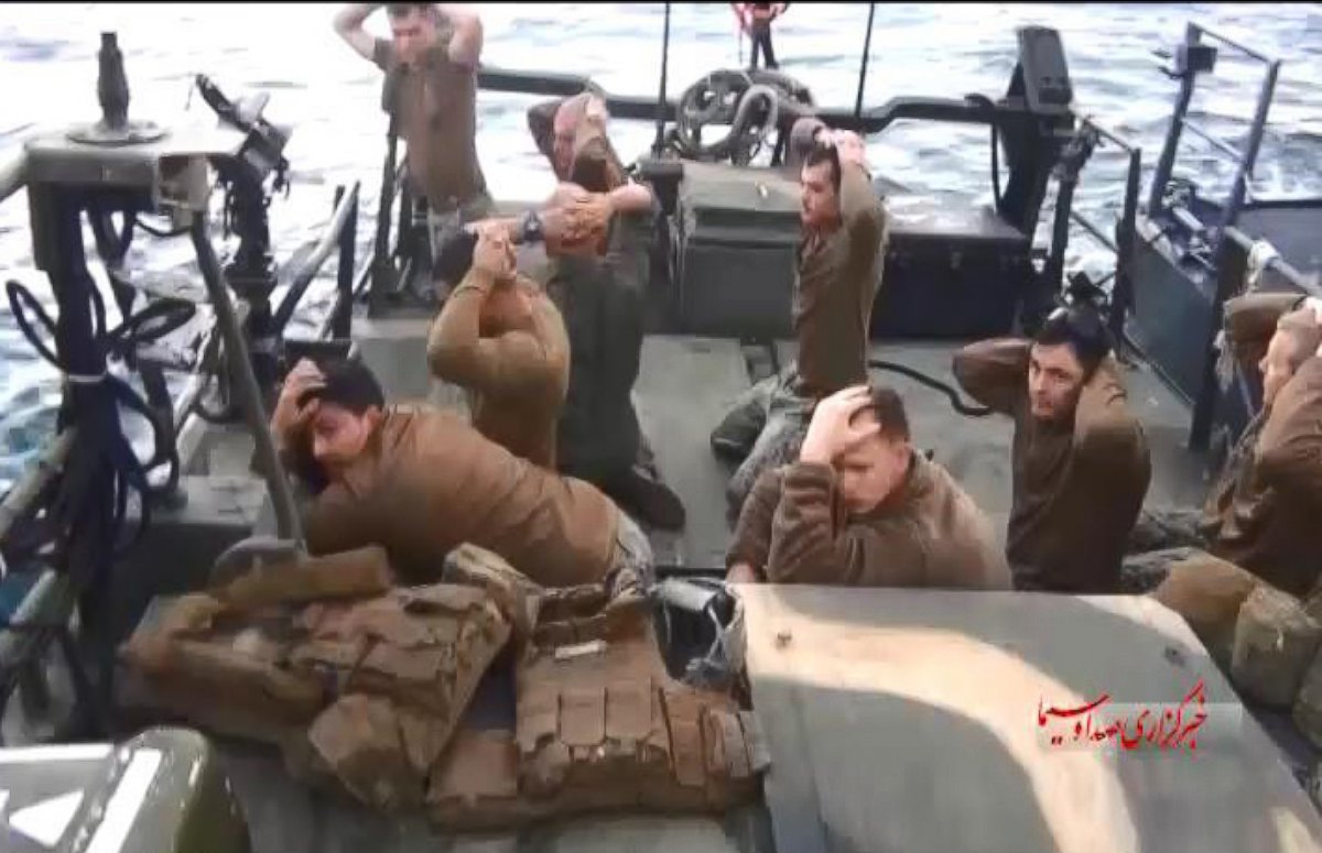 PHOTO: A handout TV grab made available shows American military personnel on their boat after they were captured by the Iranian Revolutionary Guard Corps (IRGC), at an undisclosed location in Iran, Jan. 12, 2016.