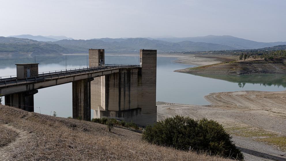 PHOTO: Visible banks, dry soil, and uncultivated vegetation replace the water at Lake Monte Cotugno, which in the summer of 2024 contains just 300 thousand cubic meters of water and is therefore practically dry, Basilicata, Italy, Oct. 16, 2024.