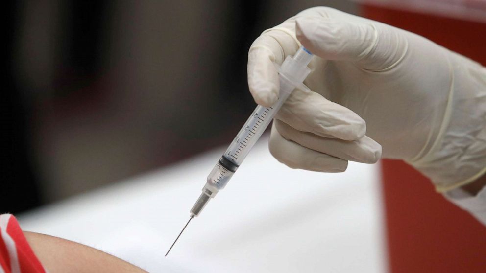 PHOTO: FILE - This Jan. 23, 2020 file photo shows a patient receiving a flu vaccination in Mesquite, Texas. On Feb. 20, 2020, the Centers for Disease Control and Prevention said the vaccine has been more than 50% effective in preventing flu illness