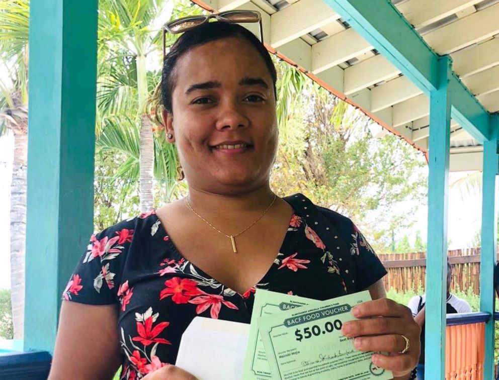 PHOTO: A woman receives her COVID-19 Food Vouchers from the Blanchards Anguilla Children’s Fund.