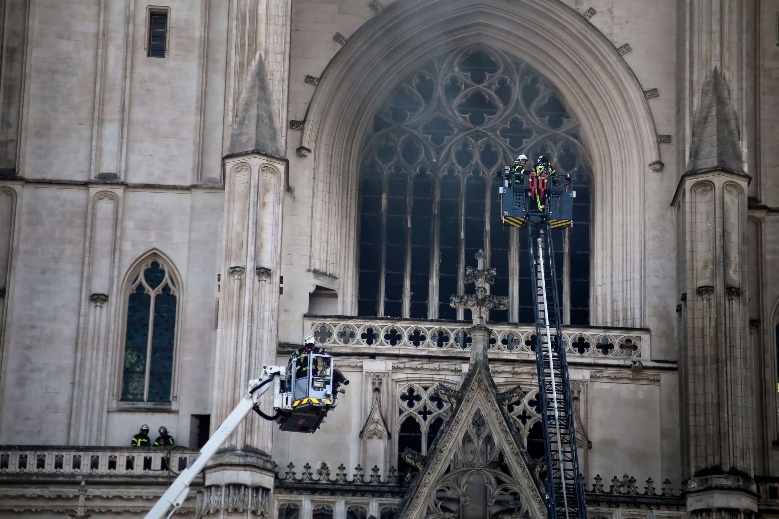 PHOTO: Fire fighters brigade work to extinguish the blaze at the Gothic St. Peter and St. Paul Cathedral, in Nantes, western France, Saturday, July 18, 2020. 