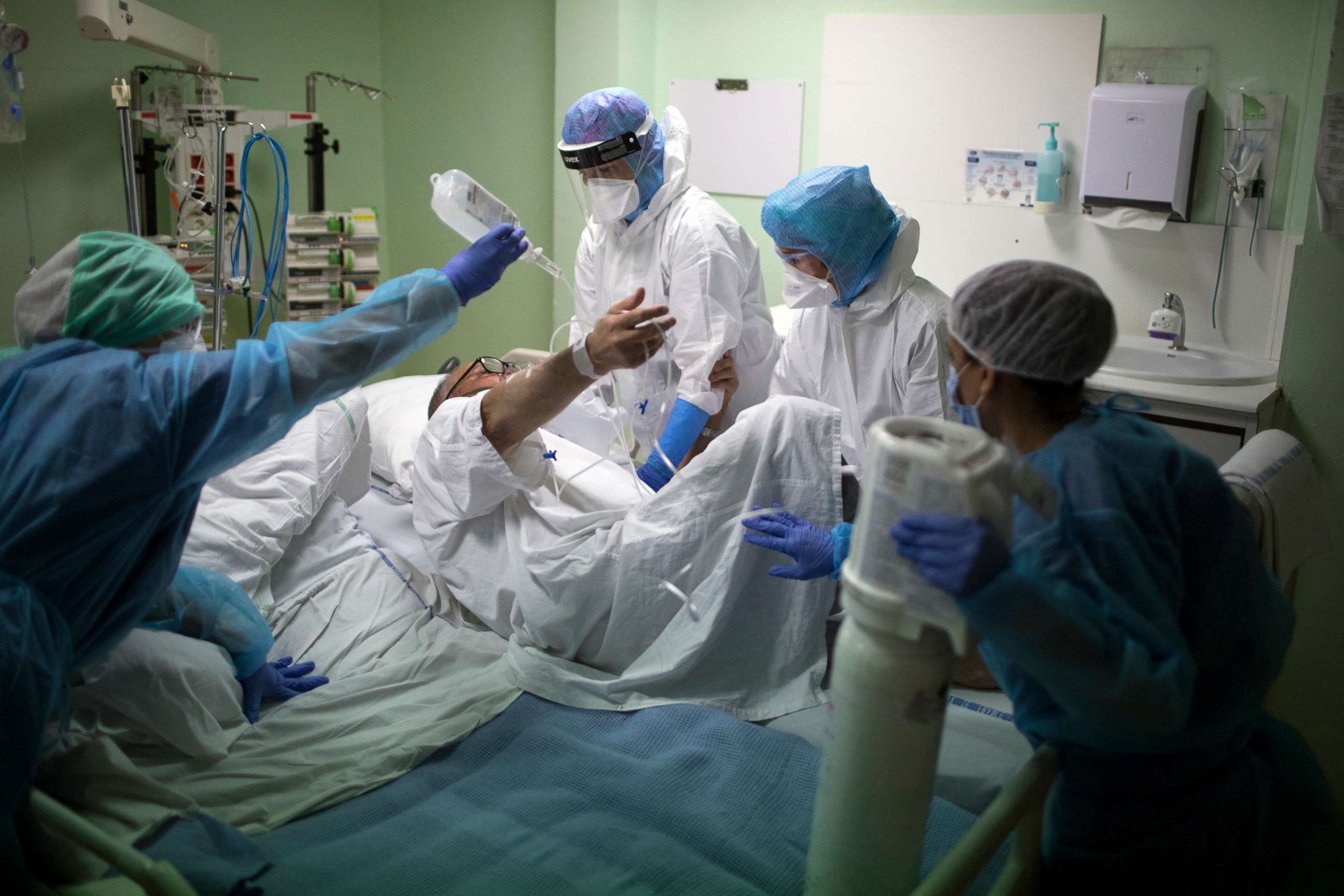 PHOTO: A medical crew receive a COVID-19 patient into the intensive care unit at the Joseph Imbert Hospital Center in Arles, southern France, Wednesday, Oct. 28, 2020. 