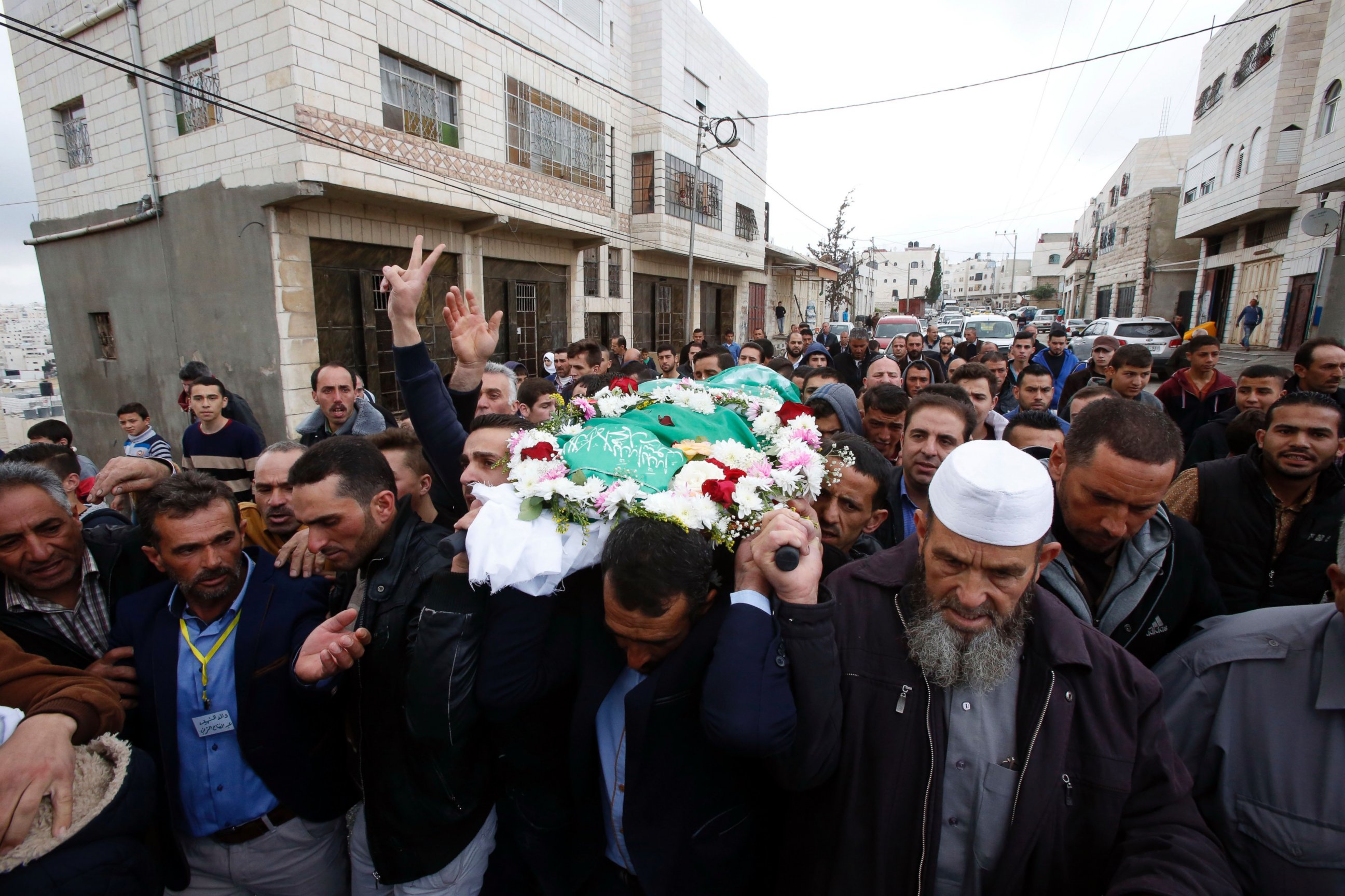 PHOTO: Relatives and friends carry the body of Abdul Fatah al-Sharif at his funeral, May 28, 2016 in Hebron.