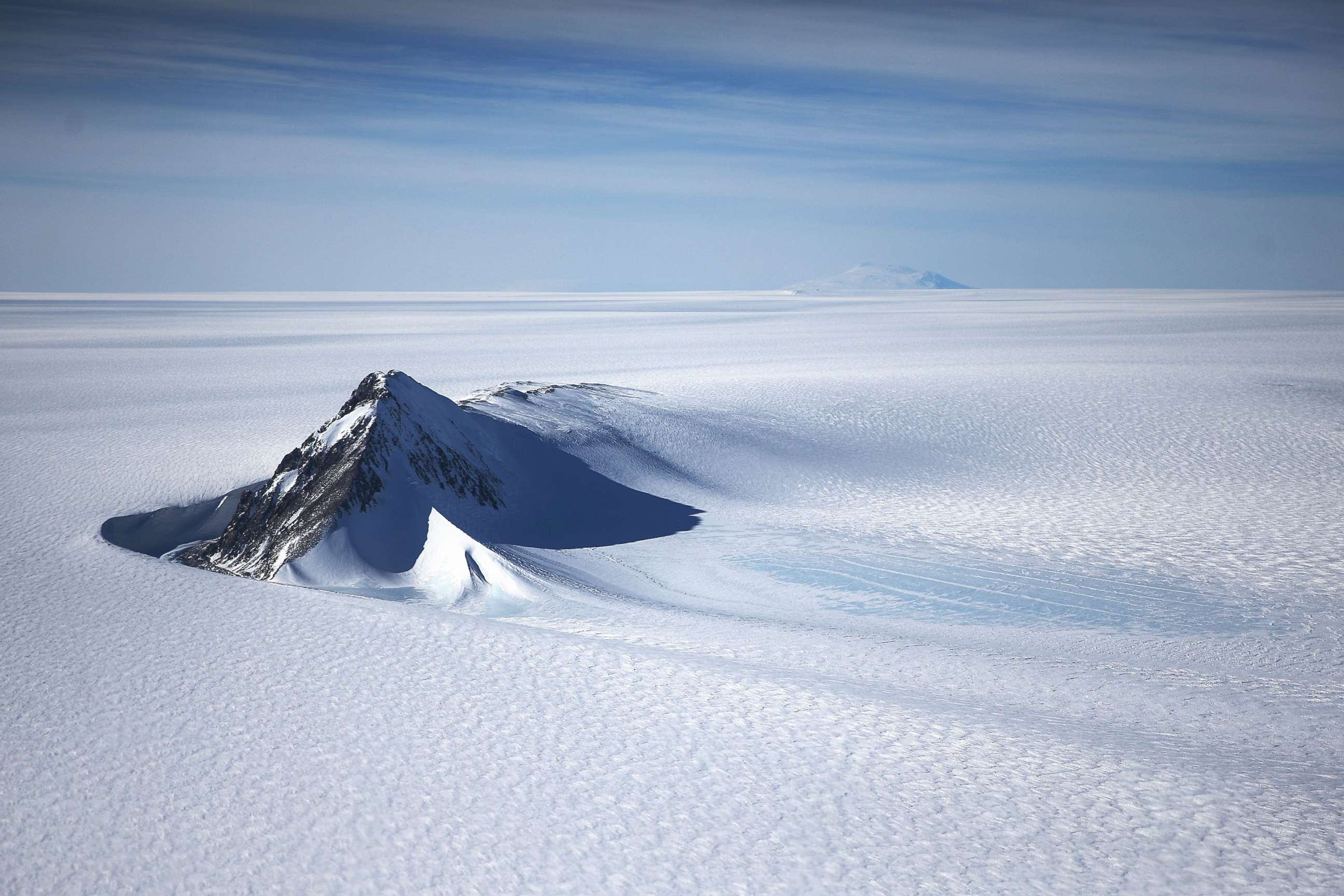 PHOTO: A section of the West Antarctic Ice Sheet with mountains is viewed from a window of a NASA Operation IceBridge airplane, Oct. 28, 2016 in-flight over Antarctica. 