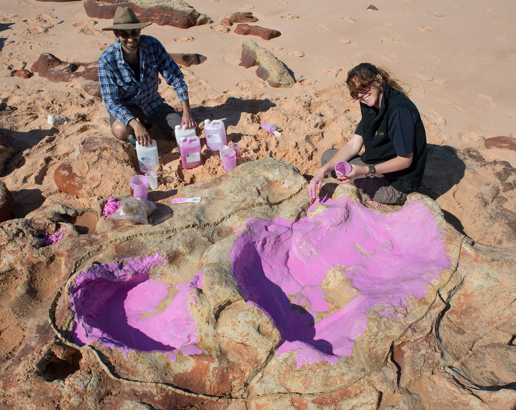 PHOTO: Dr Anthony Romilio and Linda Pollard from the University of Queensland creating a silicon cast of sauropod tracks in the Lower Cretaceous Broome Sandstone in the Walmadany area of Dampier Peninsula, Western Australia.