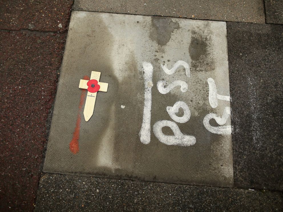 PHOTO: A single cross lies on the pavement at the scene where Lee Rigby, a soldier of the 2nd Battalion the Royal Regiment of Fusiliers, was killed on May 24, 2013 in London.