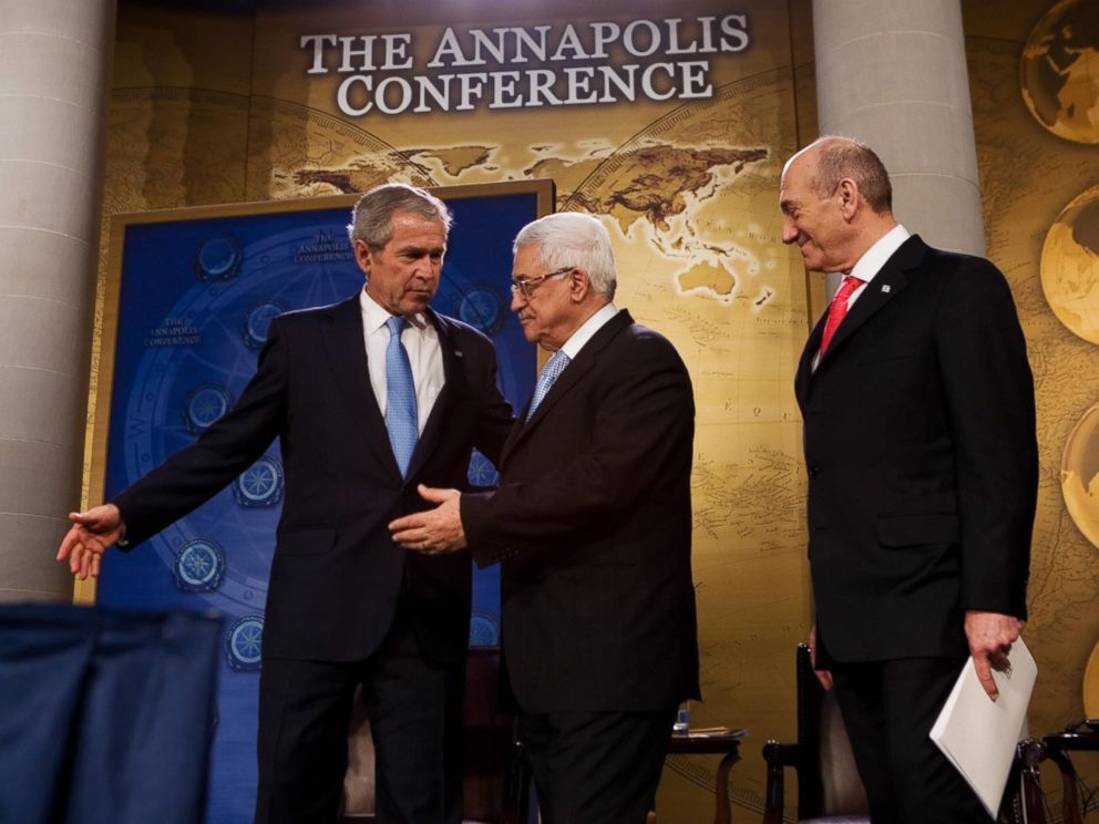 PHOTO: President George W. Bush, left, shows the way to Palestinian President Mahmud Abbas, center and Israeli Prime Minister Ehud Olmert after speaking November 27, 2007 during the Annapolis Conference at the US Naval Academy.