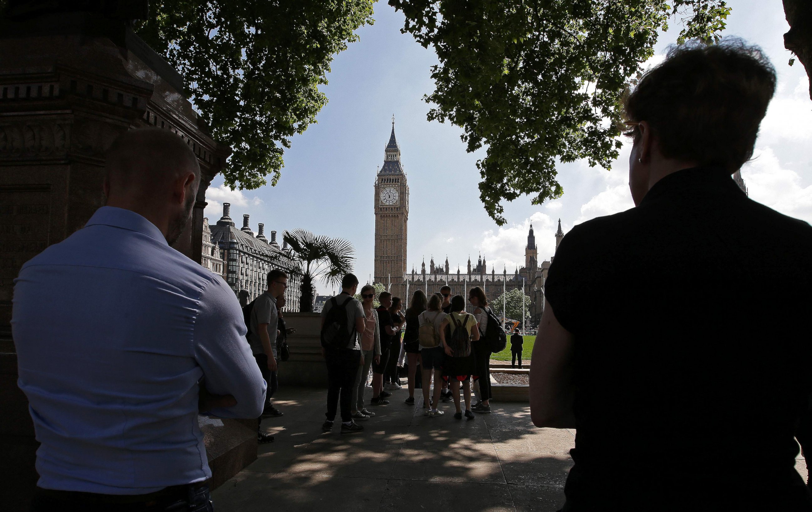 PHOTO: People stop to observe a minute's silence in Parliament Square, Westminster in central London, on May 25, 2017, as a mark of respect to the victims of the May 22 terror attack at the Manchester Arena.