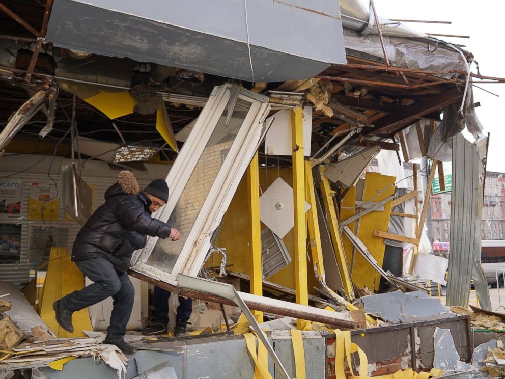 PHOTO: Muscovites inspect a demolished private trade pavilion on Feb. 9, 2016 in Moscow, Russia. Authorities have ordered 97 shopping centers, trade pavilions, street kiosks and stalls built without legal documentation near metro stations to be removed.