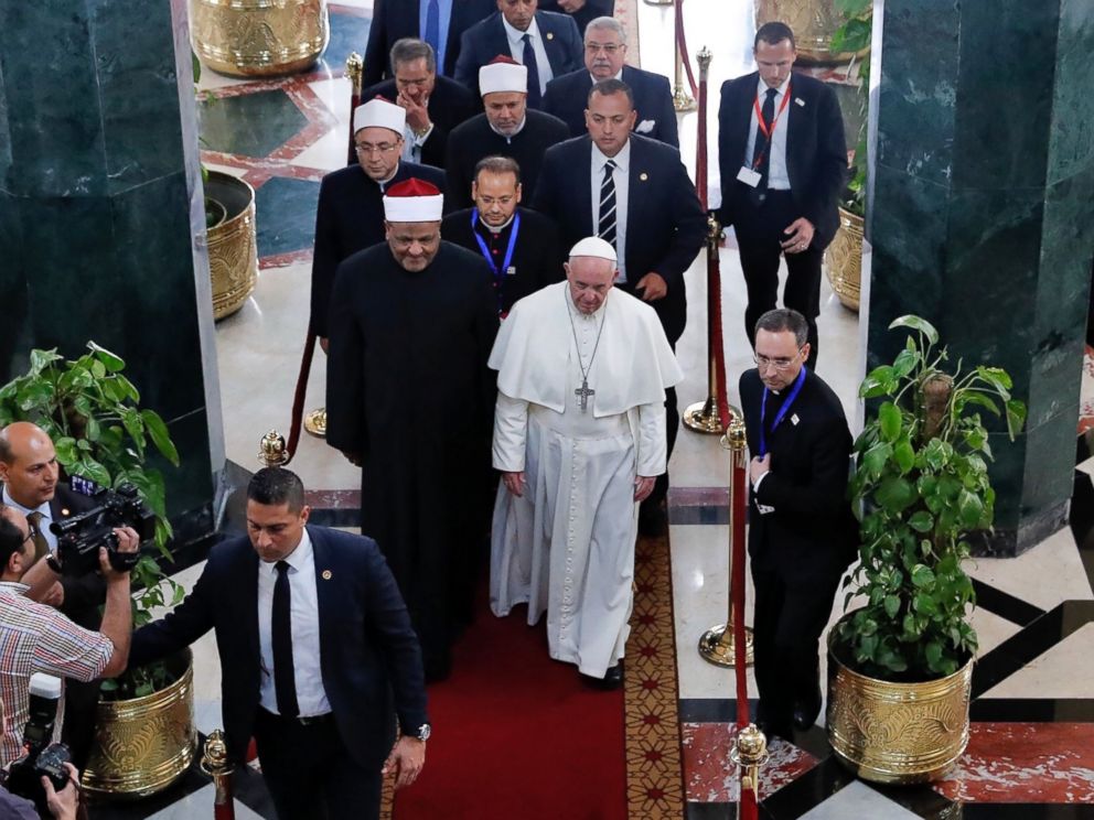 PHOTO: Pope Francis walks alongside Muslim clerics during a visit at the prestigious Sunni institution Al-Azhar, in Cairo, on April 28, 2017, during an official visit to Egypt.