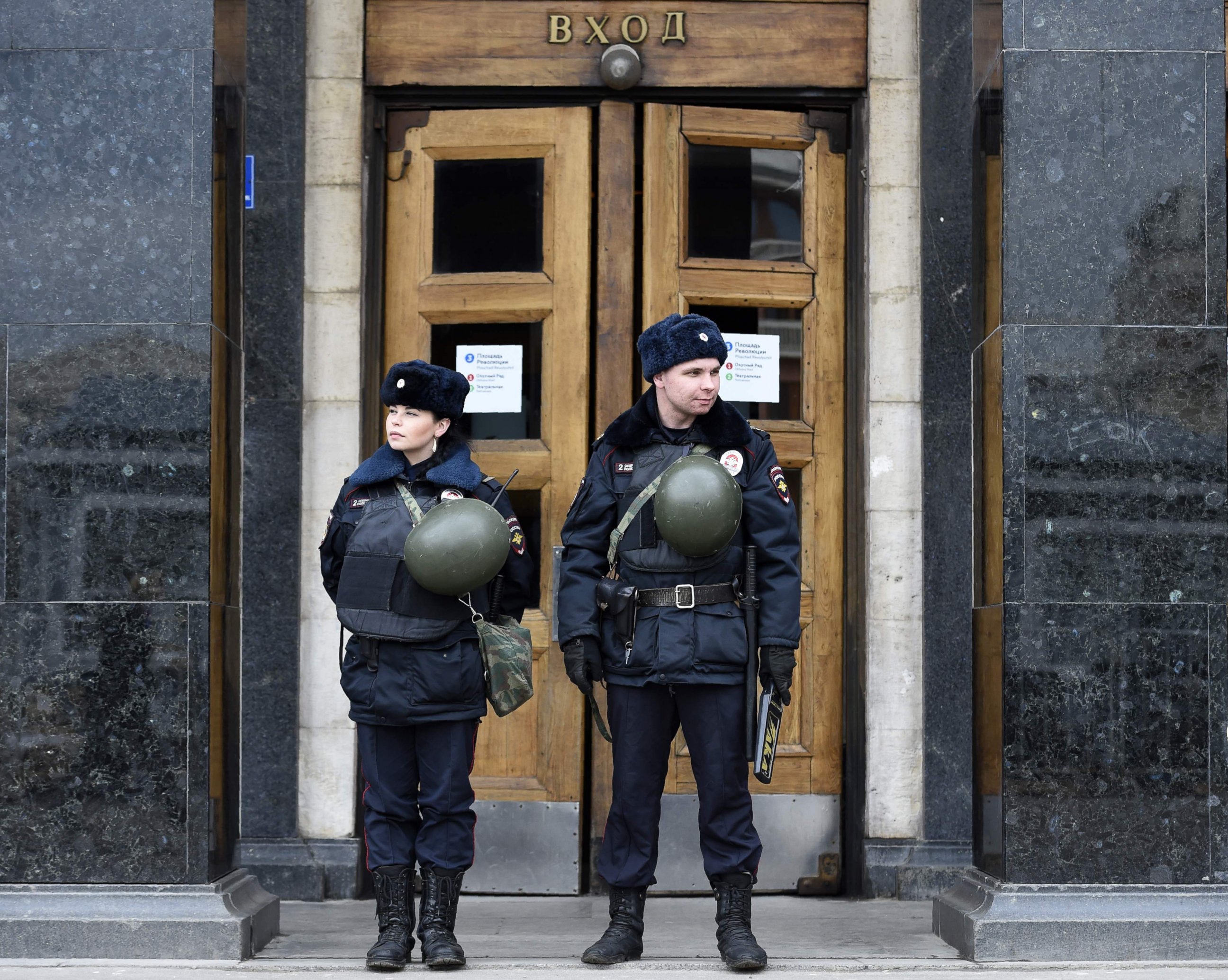 PHOTO:Police officers stand guard at the entrance to Ploschad Revolyutsii metro station, Apr. 4, 2017, in Moscow, as security measures are tightened the day after a deadly blast in the metro in St. Petersburg. 