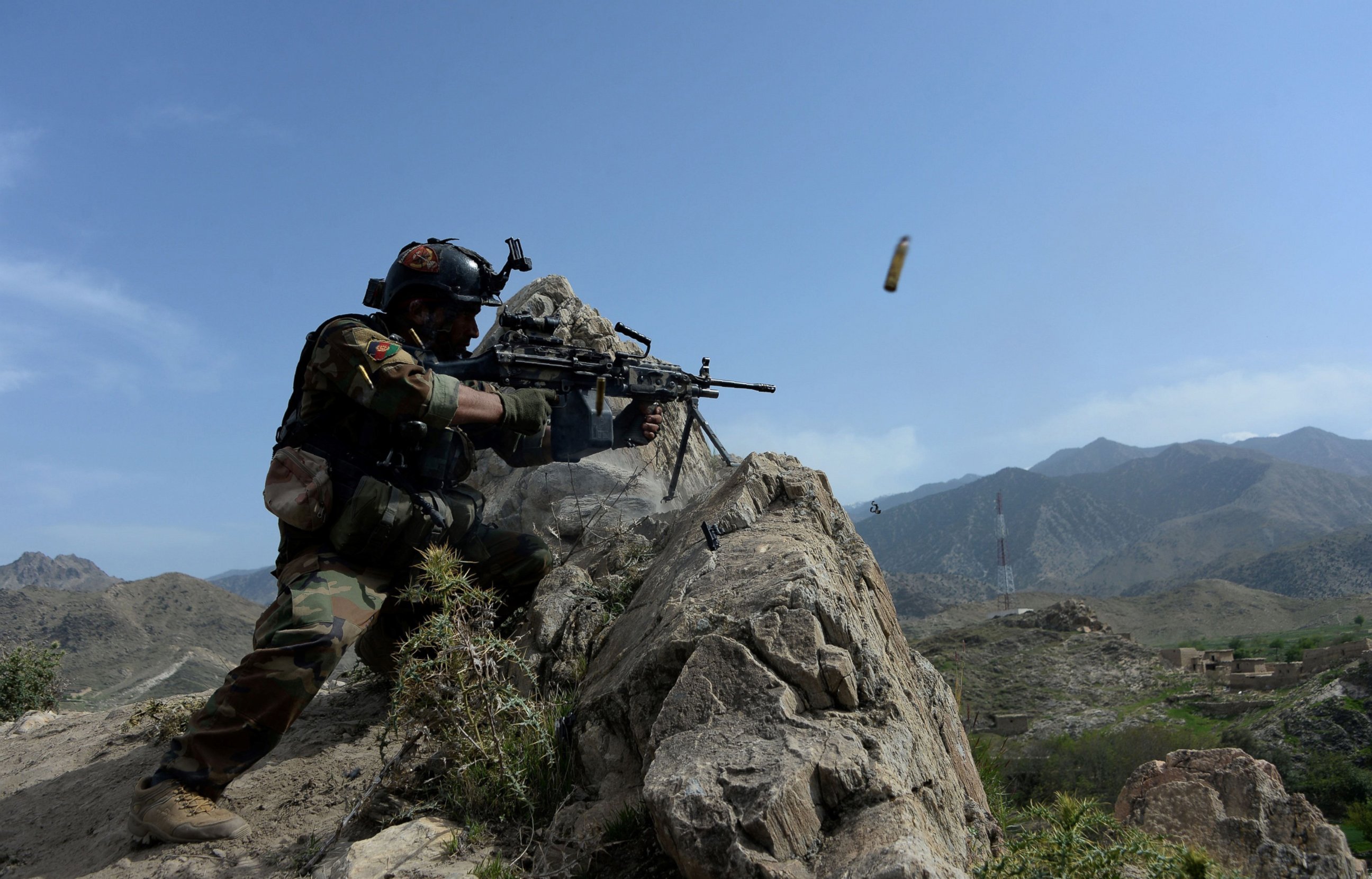 PHOTO: An Afghan security force personnel fires during an ongoing an operation against Islamic State (IS) militants in the Achin district of Nangarhar province, April 11, 2017.