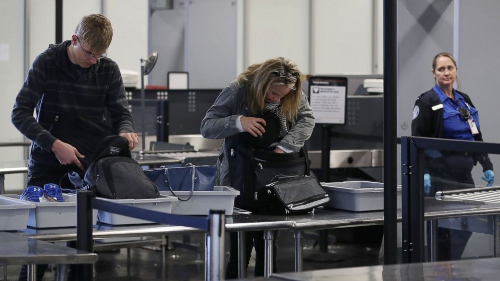 Travelers go through the security checkpoint at the Fort Lauderdale-Hollywood International airport, March 14, 2017, in Fort Lauderdale, Fla. 