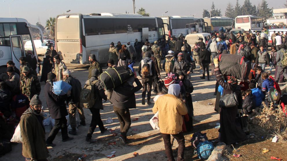 Syrians who were evacuated from the last rebel-held pockets of Syria's northen city of Aleppo, arrive, Dec. 19, 2016, in the opposition-controlled Khan al-Assal region, west of the embattled city.