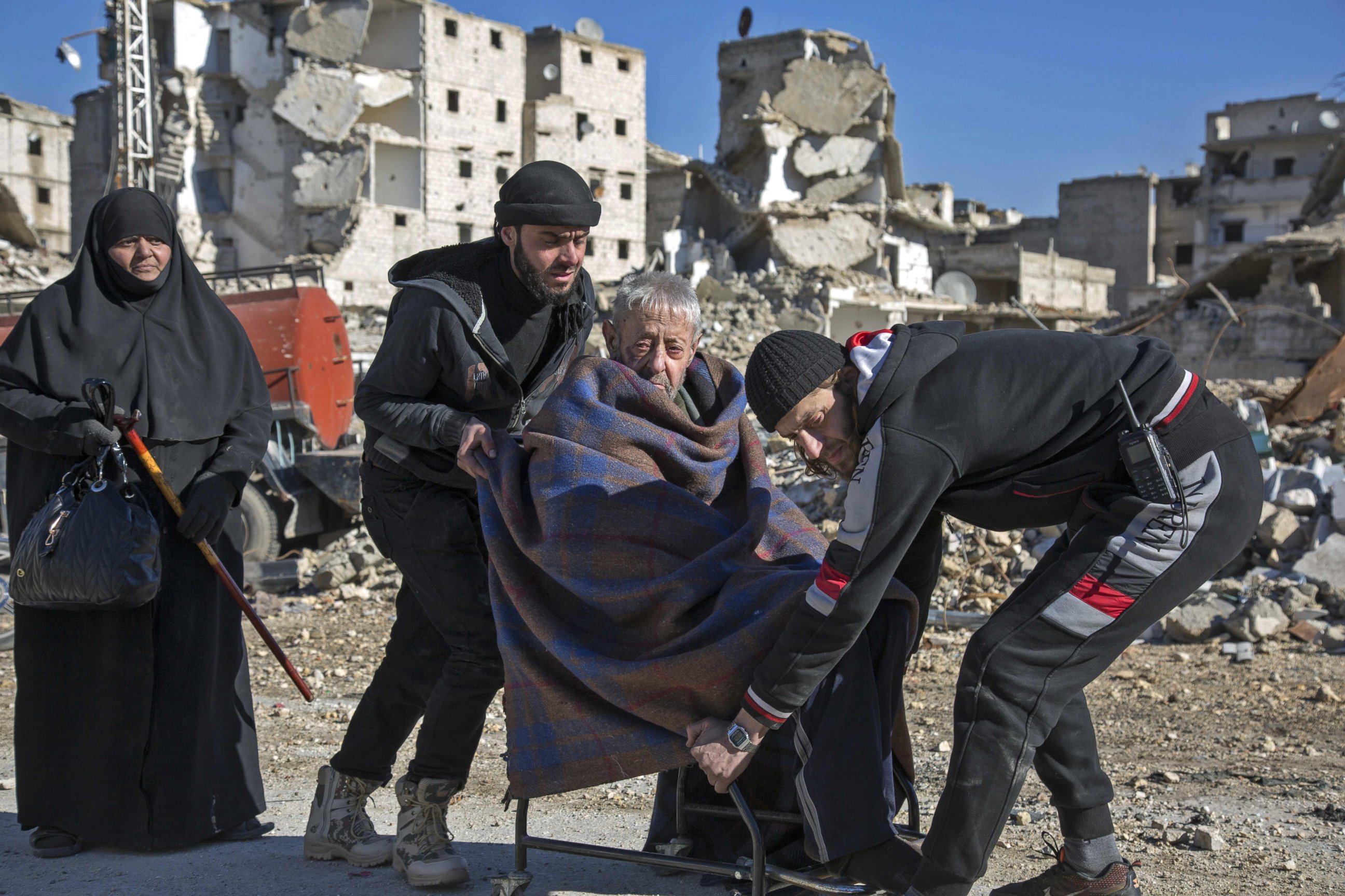 PHOTO: An elderly Syrian man is carried during an evacuation operation of rebel fighters and their families from rebel-held neighborhoods, Dec. 15, 2016 in Aleppo, Syria.
