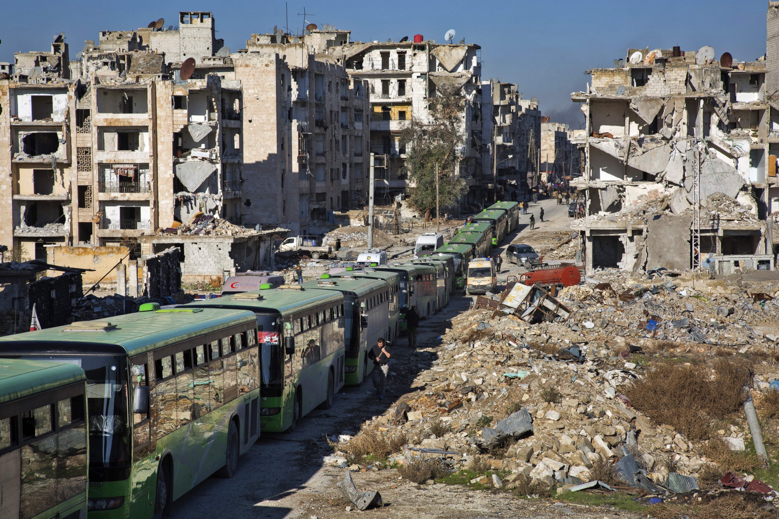 PHOTO: Buses are seen during an evacuation operation of rebel fighters and their families  from rebel-held neighborhoods in Aleppo, Syria, Dec. 15, 2016.