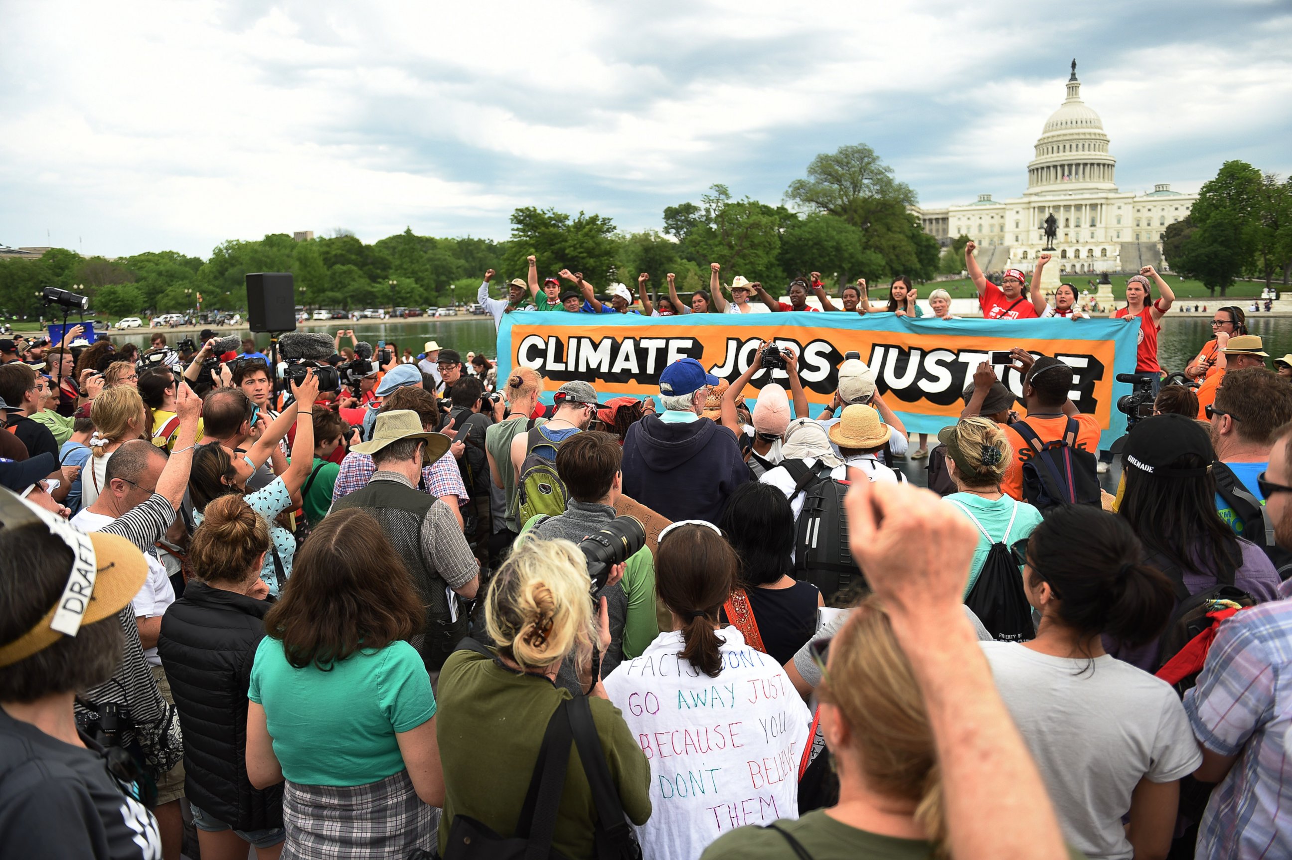 PHOTO: People gather near the U.S. Capitol for the People's Climate Movement before marching to the White House to protest President Donald Trump's environmental policies, April 29, 2017 in Washington, D.C. 