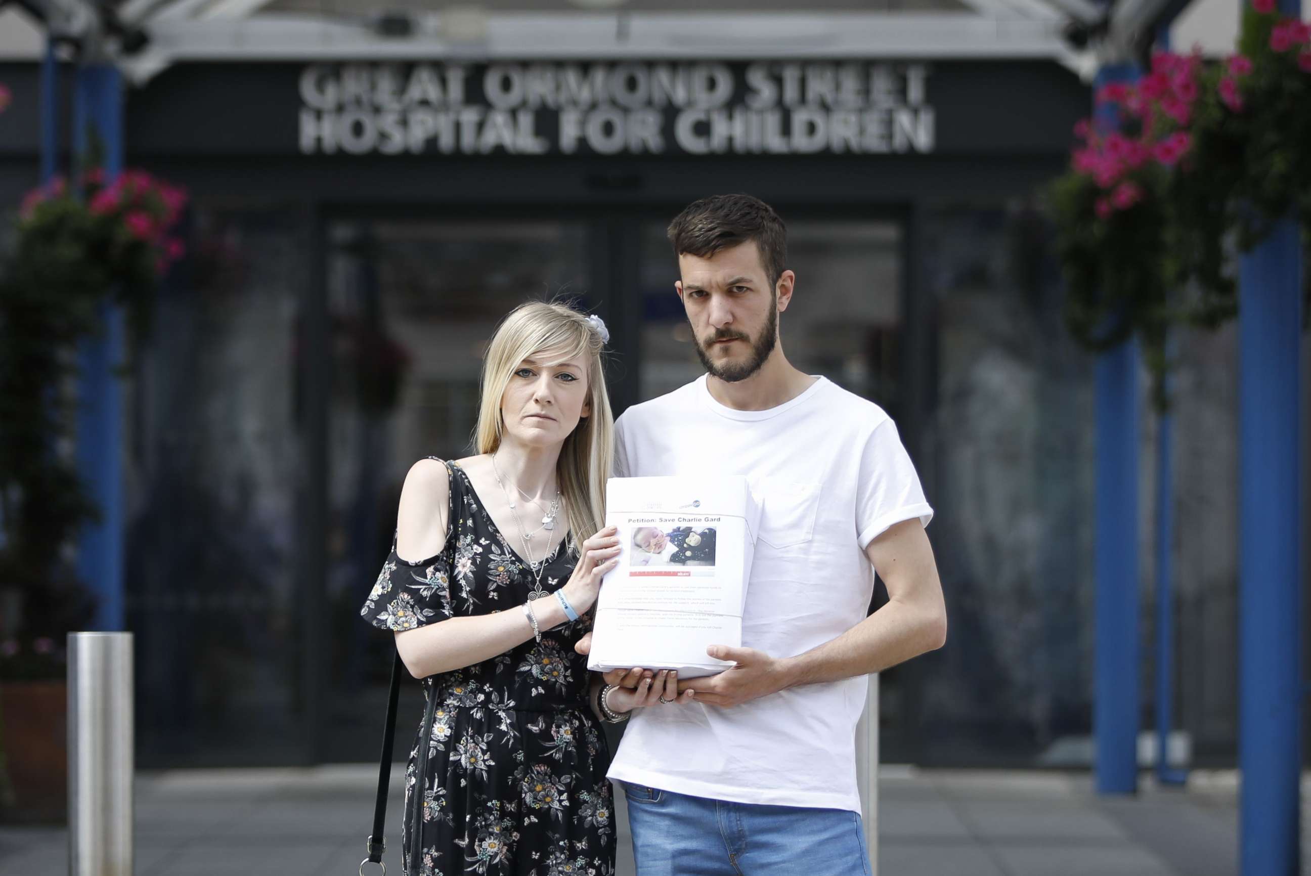 PHOTO: Connie Yates, left, and Chris Gard, parents of terminally-ill 10-month-old Charlie Gard, pose with a petition of signatures supporting their case, July 9, 2017.  

