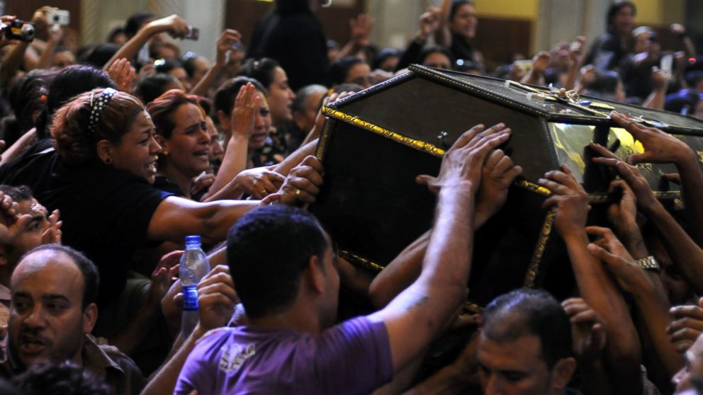 PHOTO: Egyptian Copts mourn over the coffin of a victim of deadly clashes, during a funeral at Abassaiya Cathedral in Cairo, Oct. 10, 2011, a day after 24 people, mostly Christians, died in clashes with Egyptian security forces.