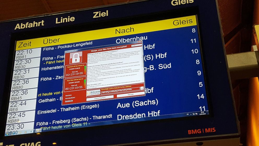 PHOTO: A window announcing the encryption of data including a requirement to pay appears on an electronic timetable display at the railway station in Chemnitz, eastern Germany, May 12, 2017.
