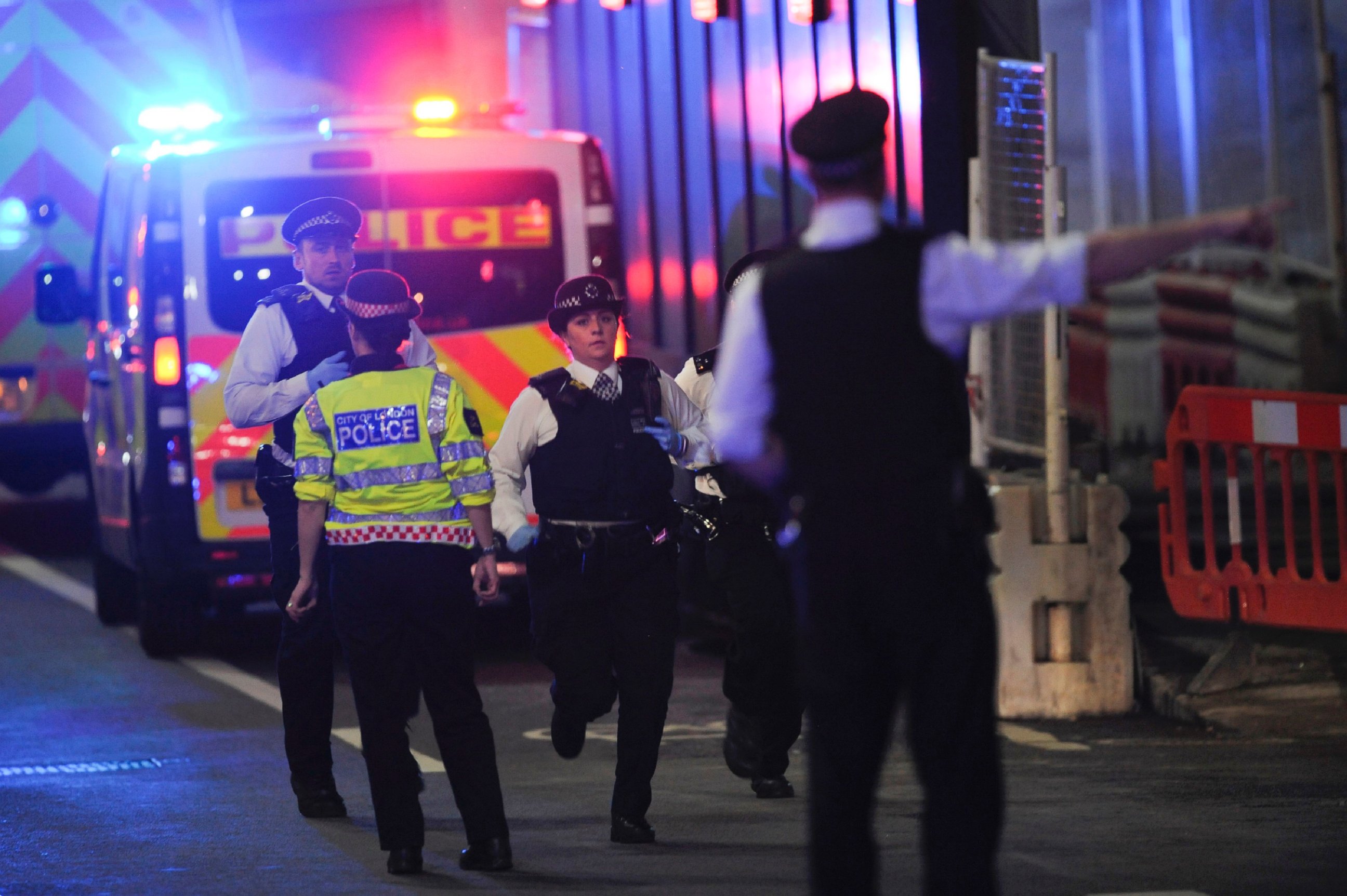 PHOTO: Police officers run at the scene of an apparent terror attack on London Bridge in central London on June 3, 2017.
