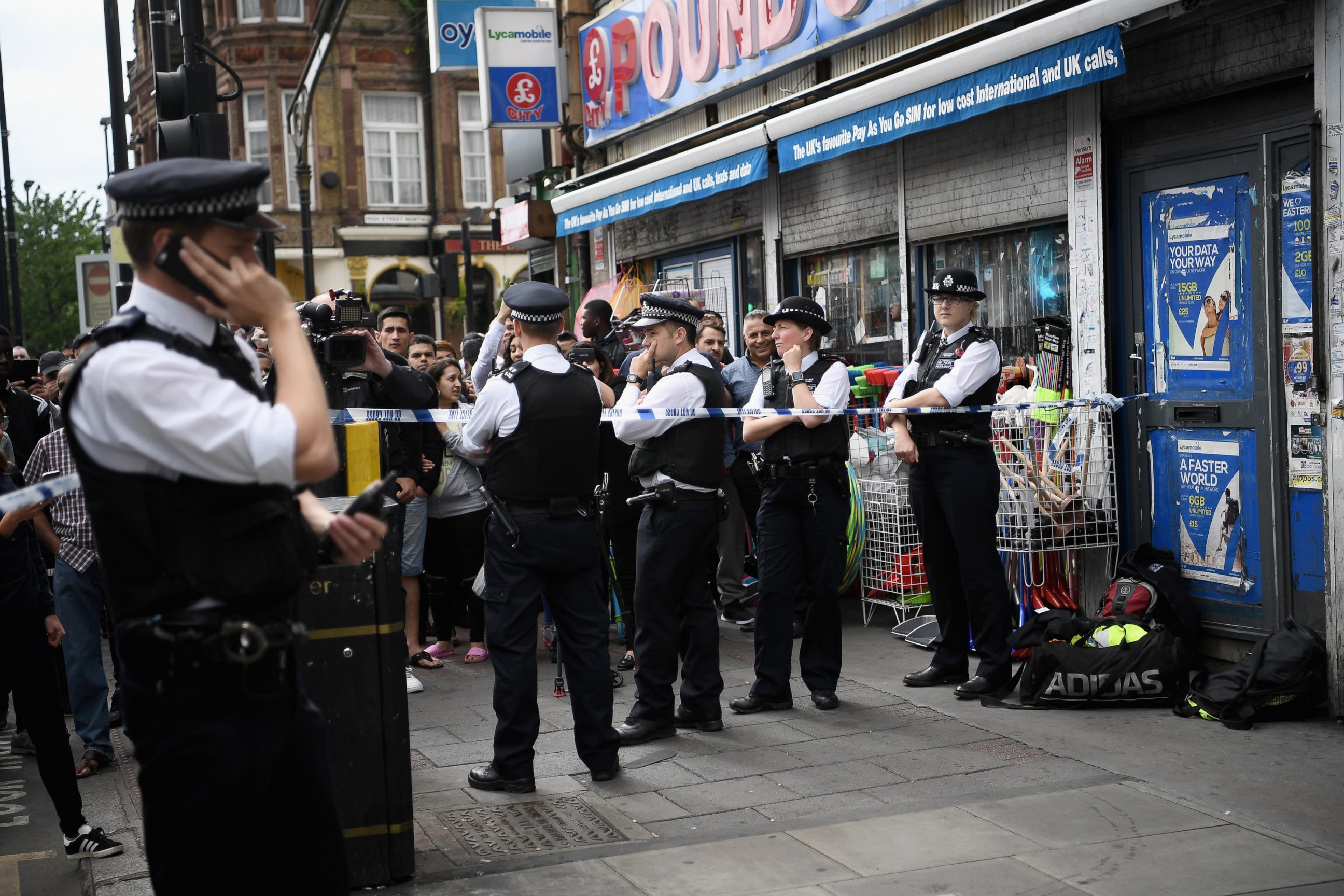 PHOTO: Police officers stand outside a property in East Ham which has been raided by police, June 4, 2017 in London, England. 