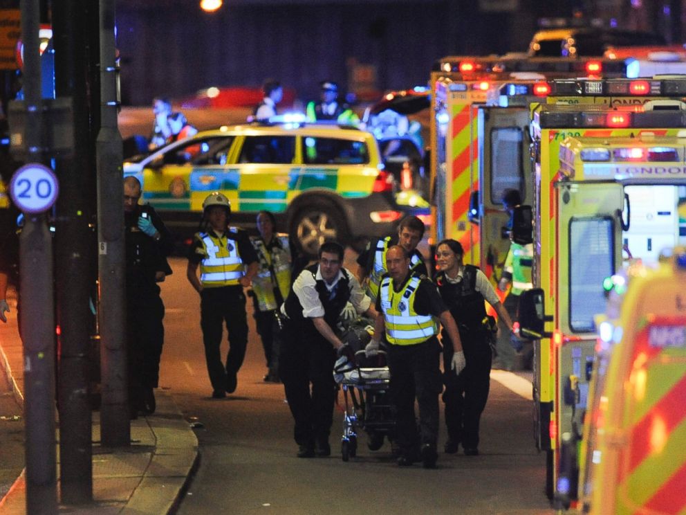 PHOTO: Police officers and members of the emergency services attend to a person injured in an apparent terror attack on London Bridge in central London on June 3, 2017.