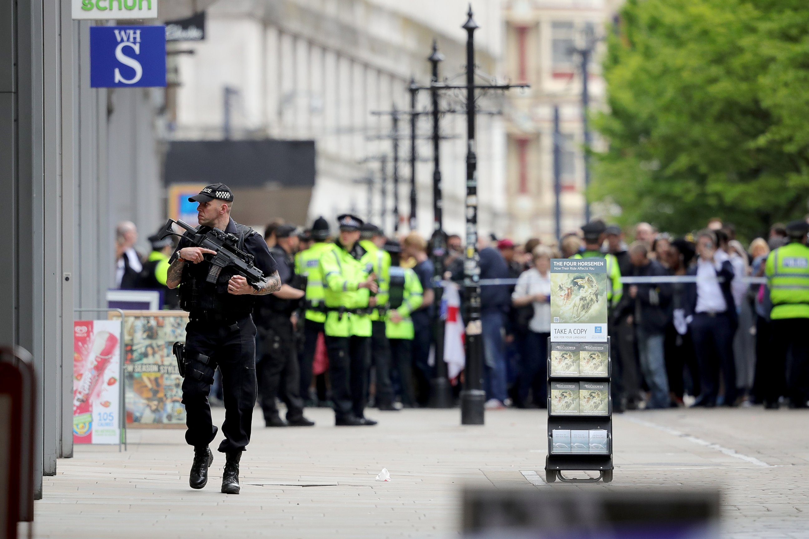 PHOTO: Crowds of people wait outside after police evacuated the Arndale Centre, May 23, 2017, in Manchester, England.