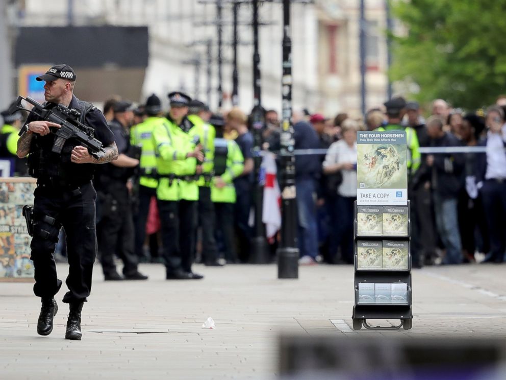 PHOTO: Crowds of people wait outside after police evacuated the Arndale Centre, May 23, 2017, in Manchester, England.