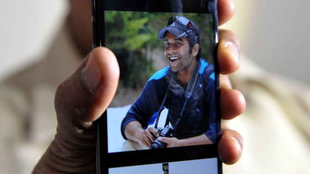 PHOTO: Indian man Jagan Mohan Reddy holds a smartphone with an image of his son Alok Madasani at his residence in Hyderabad, Feb. 24, 2017, after Alok was injured in a shooting in the US state of Kansas.  
