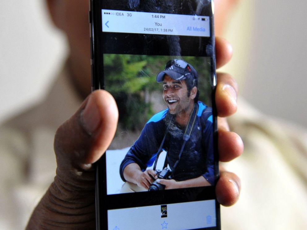 PHOTO: Indian man Jagan Mohan Reddy holds a smartphone with an image of his son Alok Madasani at his residence in Hyderabad, Feb. 24, 2017, after Alok was injured in a shooting in the US state of Kansas.