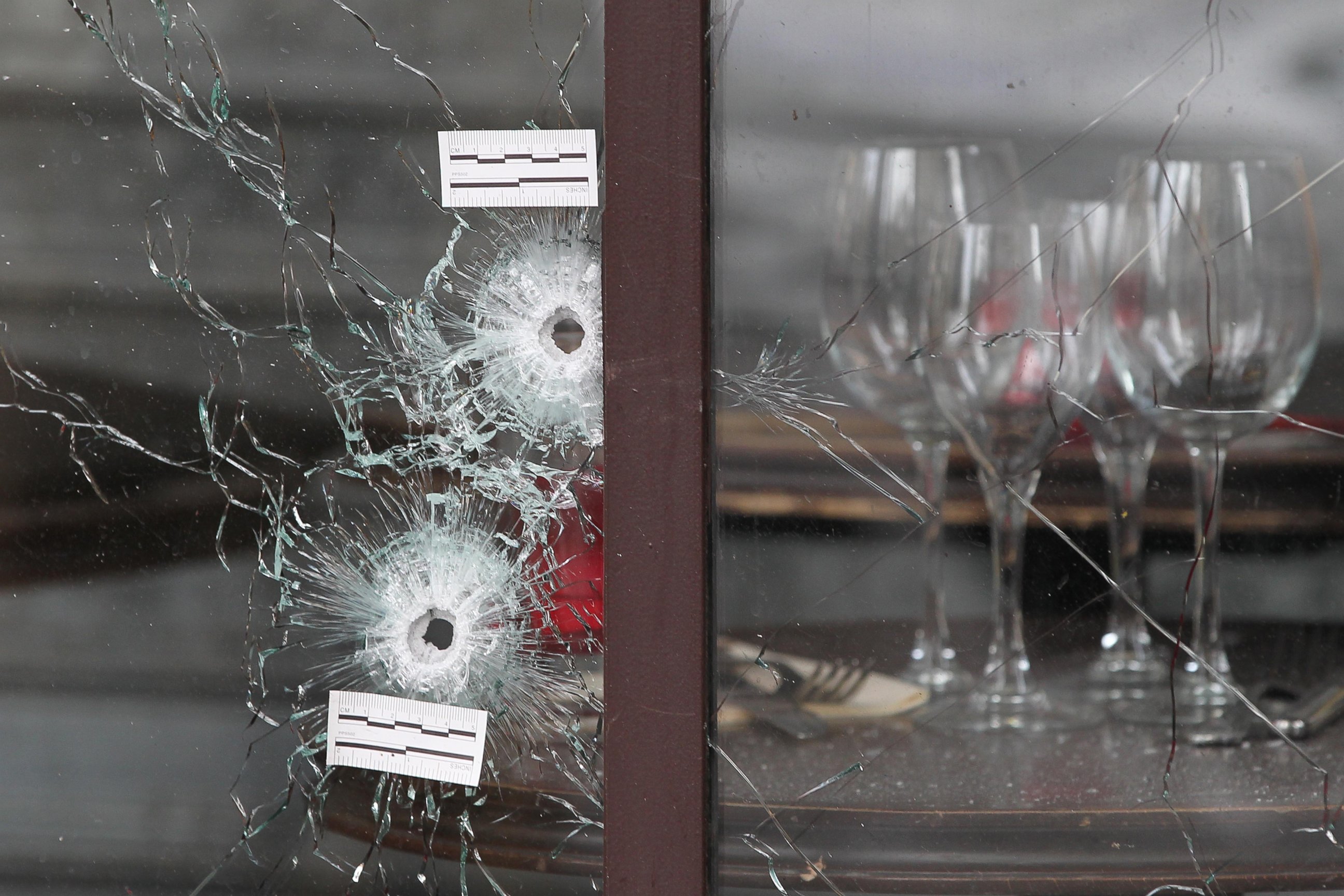 PHOTO: Bullet holes are seen as the French police takes security measures at Bataclan concert hall and "La Belle Equipe" restaurant in 11th district of Paris, France, Nov. 14, 2015.