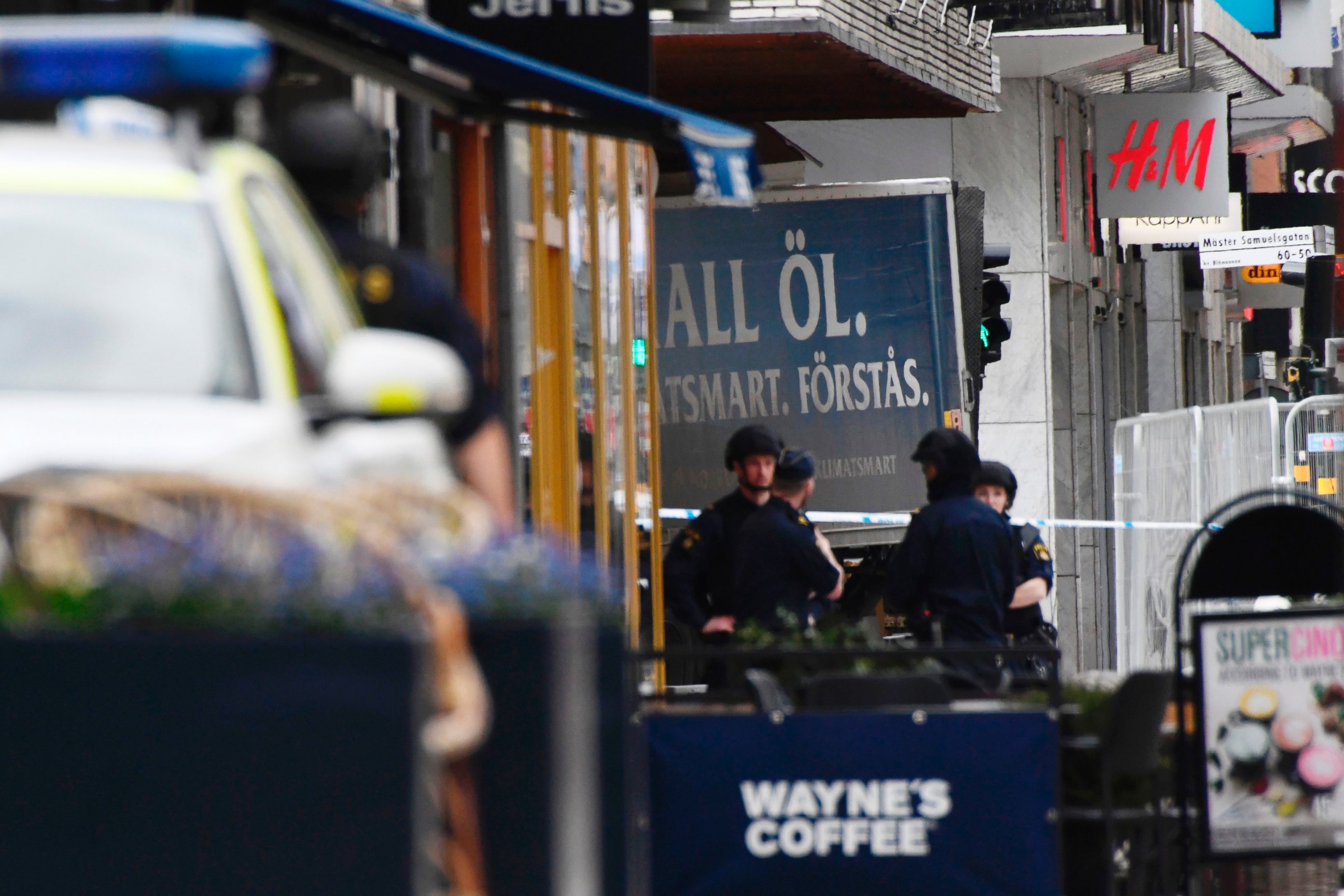 PHOTO: Police work at the scene where a truck crashed into the Ahlens department store at Drottninggatan in central Stockholm, April 7, 2017.