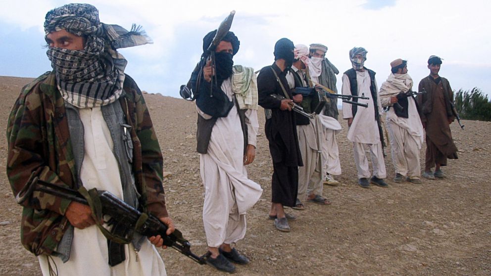 PHOTO: Fighters with Afghanistan's Taliban militia stand on a hillside at Maydan Shahr in Wardak province, west of Kabul, in this Sept. 26, 2008 file photo. 