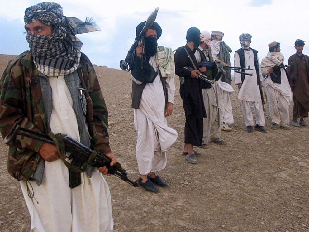 PHOTO: Fighters with Afghanistans Taliban militia stand on a hillside at Maydan Shahr in Wardak province, west of Kabul, in this Sept. 26, 2008 file photo.