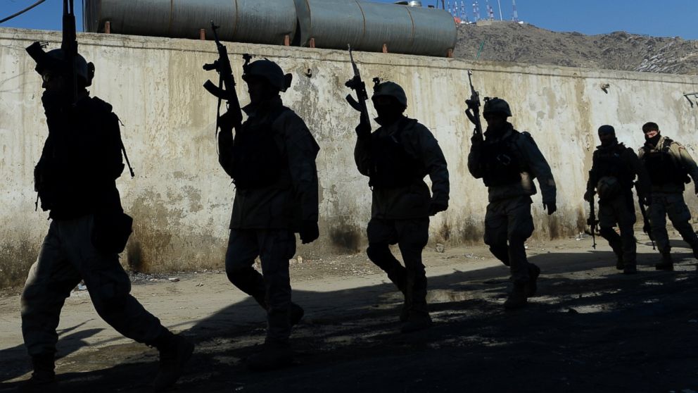 Afghan commandos near the Kabul police headquarters building in January of 2013 after a clash between Afghanistan forces and Taliban fighters in Kabul. 