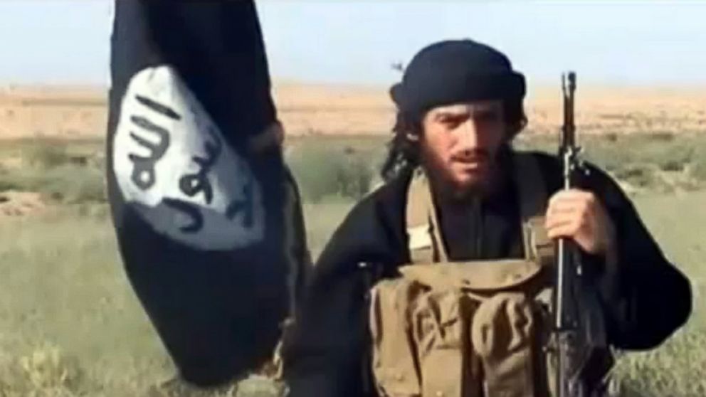 A grab taken on Oct. 2, 2013 from a video uploaded on YouTube on July 8, 2012, shows the spokesman for the Islamic State of Iraq and the Levant (ISIS), Abu Mohammad al-Adnani al-Shami, speaking next to an Islamist flag at an undisclosed location. 