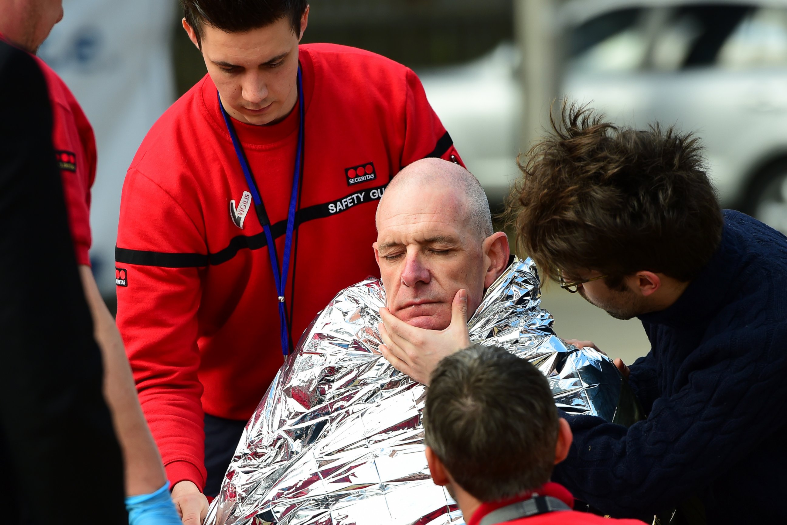 PHOTO: A victim receives first aid by rescuers, March 22, 2016 near Maalbeek metro station in Brussels, after a blast at this station near the EU institutions caused deaths and injuries. 