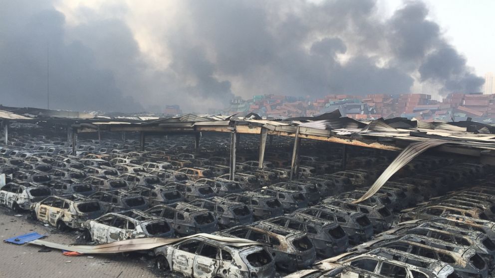 PHOTO: Debris continues to burn following the explosion of a warehouse in Binhai New Area on Aug. 13, 2015 in Tianjin, China.  