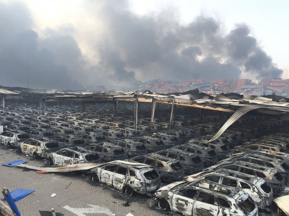 PHOTO: Debris continues to burn following the explosion of a warehouse in Binhai New Area on Aug. 13, 2015 in Tianjin, China.  