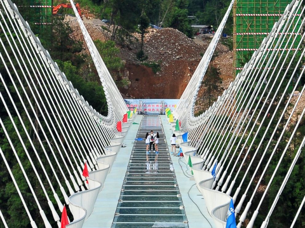 PHOTO: The world's longest and highest glass-bottomed bridge stretches over the Zhangjiajie Grand Canyon in Zhangjiajie, Hunan Province of China, on June 12, 2016. 