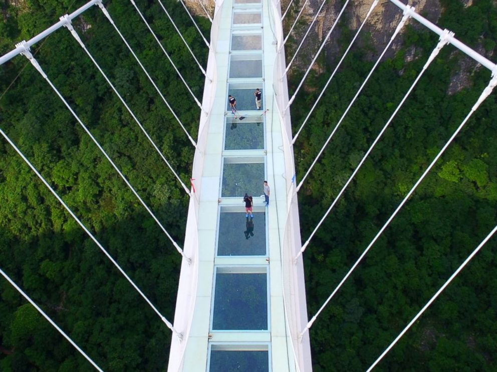 PHOTO: An aerial view of the glass-bottomed bridge across the Zhangjiajie Grand Canyon is pictured on June 12, 2016 in Zhangjiajie, Hunan Province of China. 