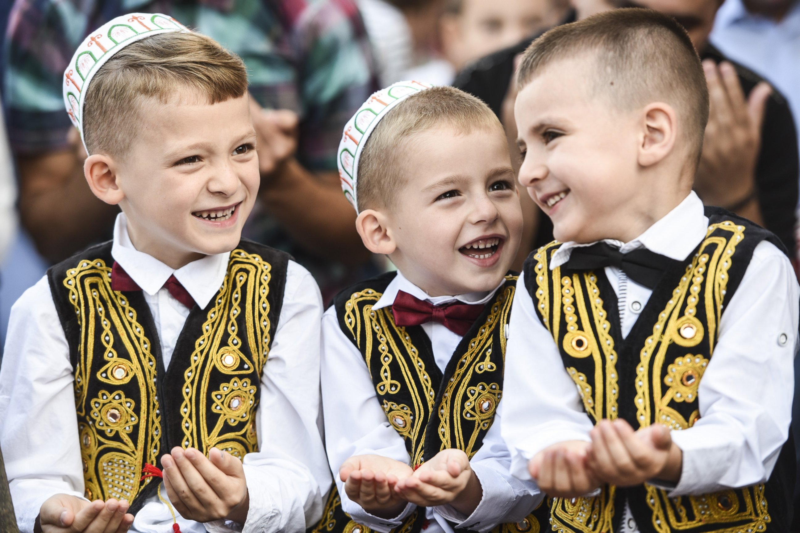 PHOTO: Young Kosovo muslims take part in a prayer during a celebration of Eid al-Fitr marking the end of the fasting month of Ramadan at the Sulltan Mehmet Fatih mosque in Pristina on July 17, 2015. 